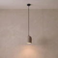 Archy Pendant — pumice stone, black cord — More Circular